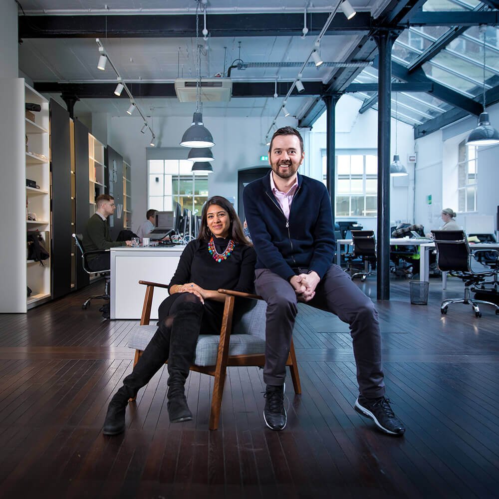 Aarti Arora Boussier and Jordan Mayo sitting